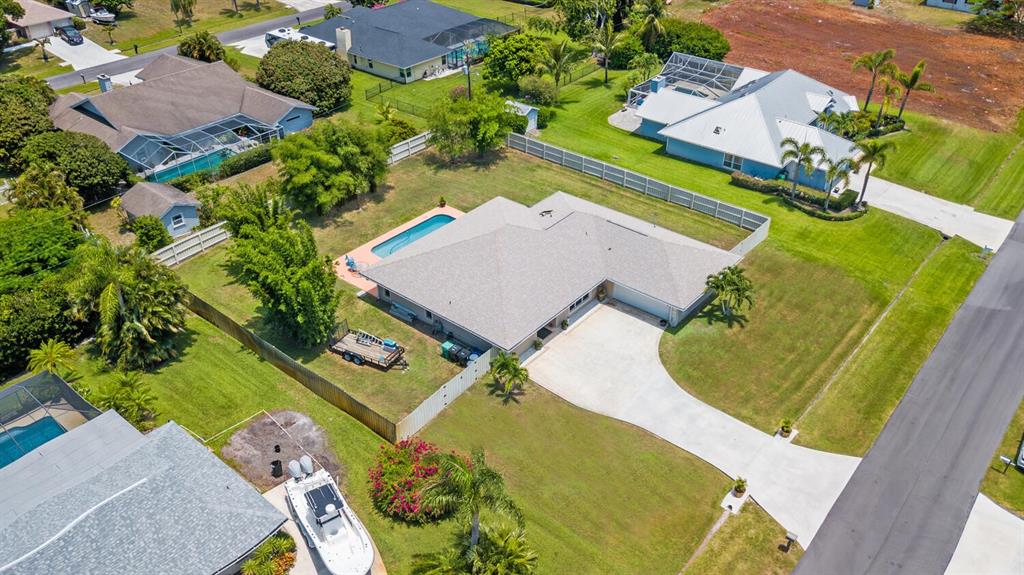 2962 Southeast Darien Road Port St. Lucie, FL 34952 - Photo 2 of 33 an aerial view of a house with a swimming pool