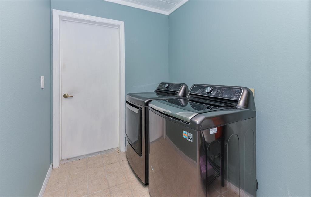 2962 Southeast Darien Road Port St. Lucie, FL 34952 - Photo 25 of 33 a utility room with washer and dryer