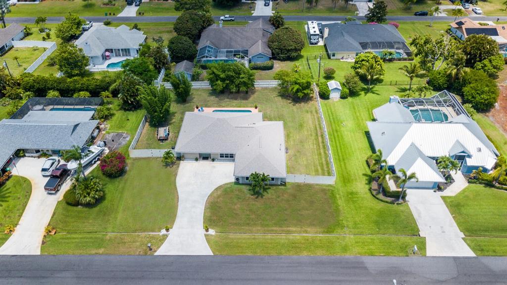 2962 Southeast Darien Road Port St. Lucie, FL 34952 - Photo 4 of 33 an aerial view of a house with yard swimming pool and outdoor seating