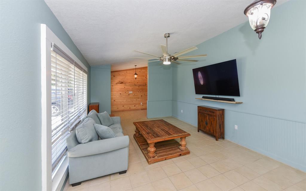 2962 Southeast Darien Road Port St. Lucie, FL 34952 - Photo 9 of 33 a living room with furniture and a flat screen tv