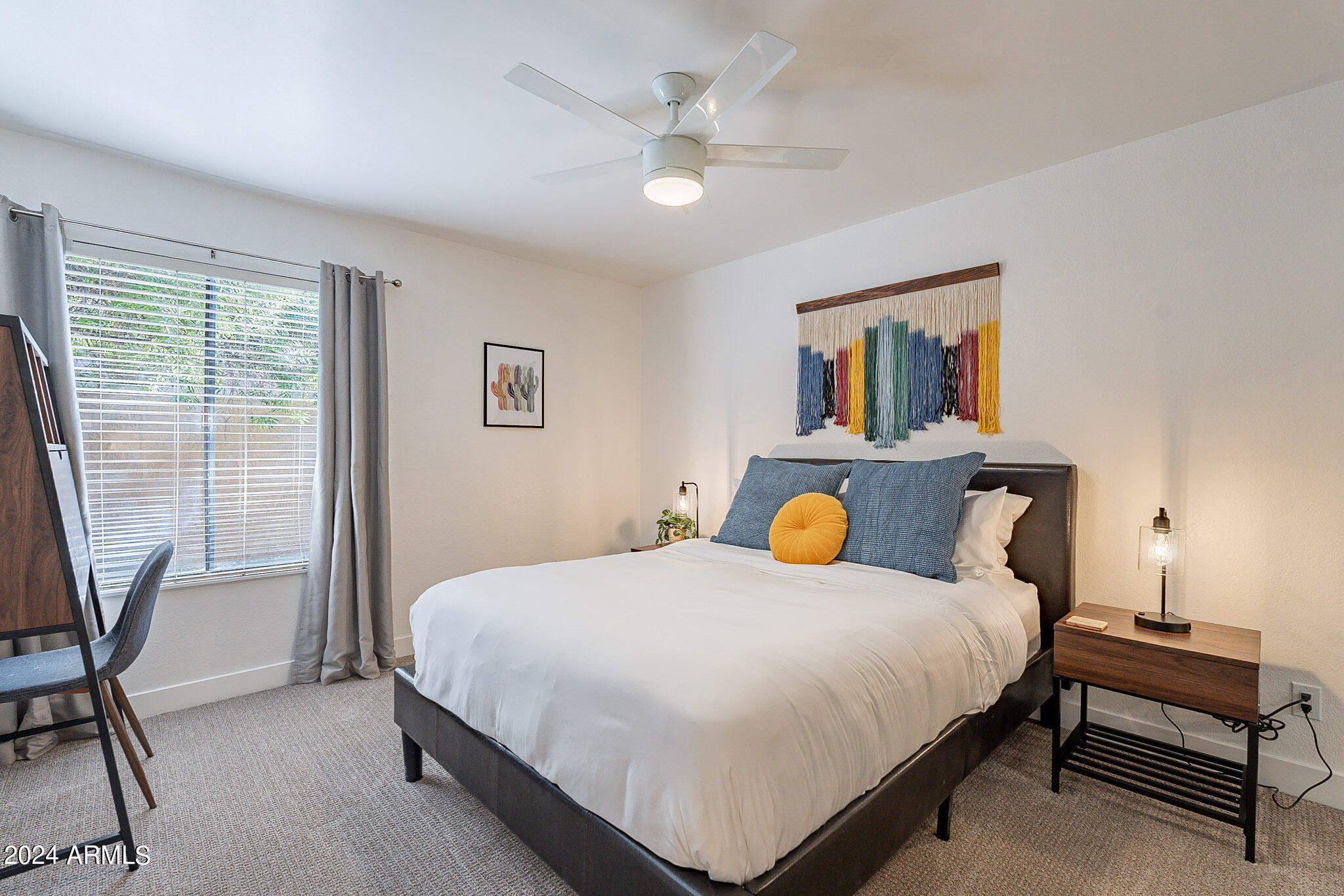 3500 North Hayden Road, Unit 1005 Scottsdale, AZ 85251 - Photo 16 of 51 a bedroom with a bed and a table