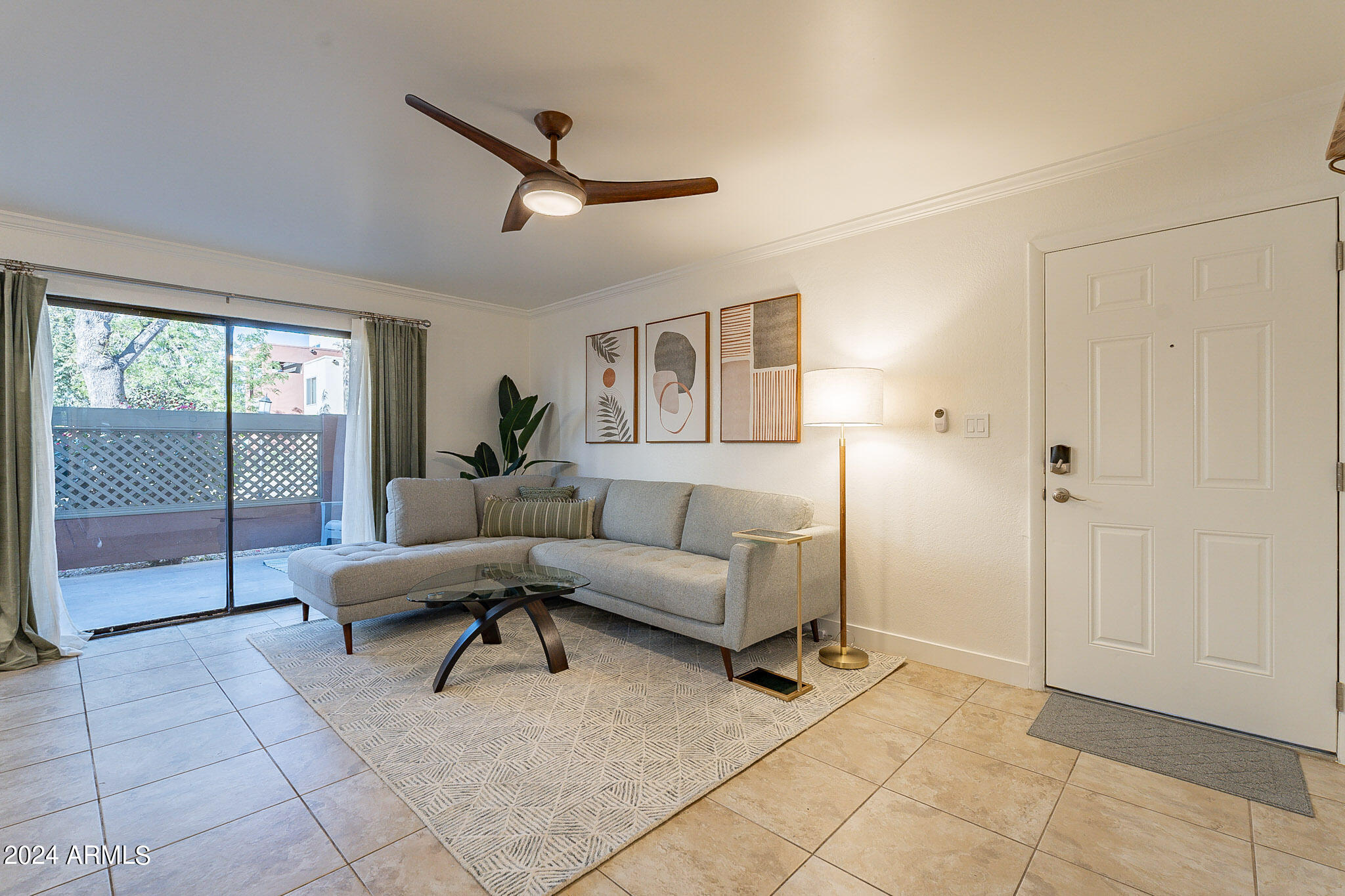 3500 North Hayden Road, Unit 1005 Scottsdale, AZ 85251 - Photo 2 of 51 a living room with furniture and a window