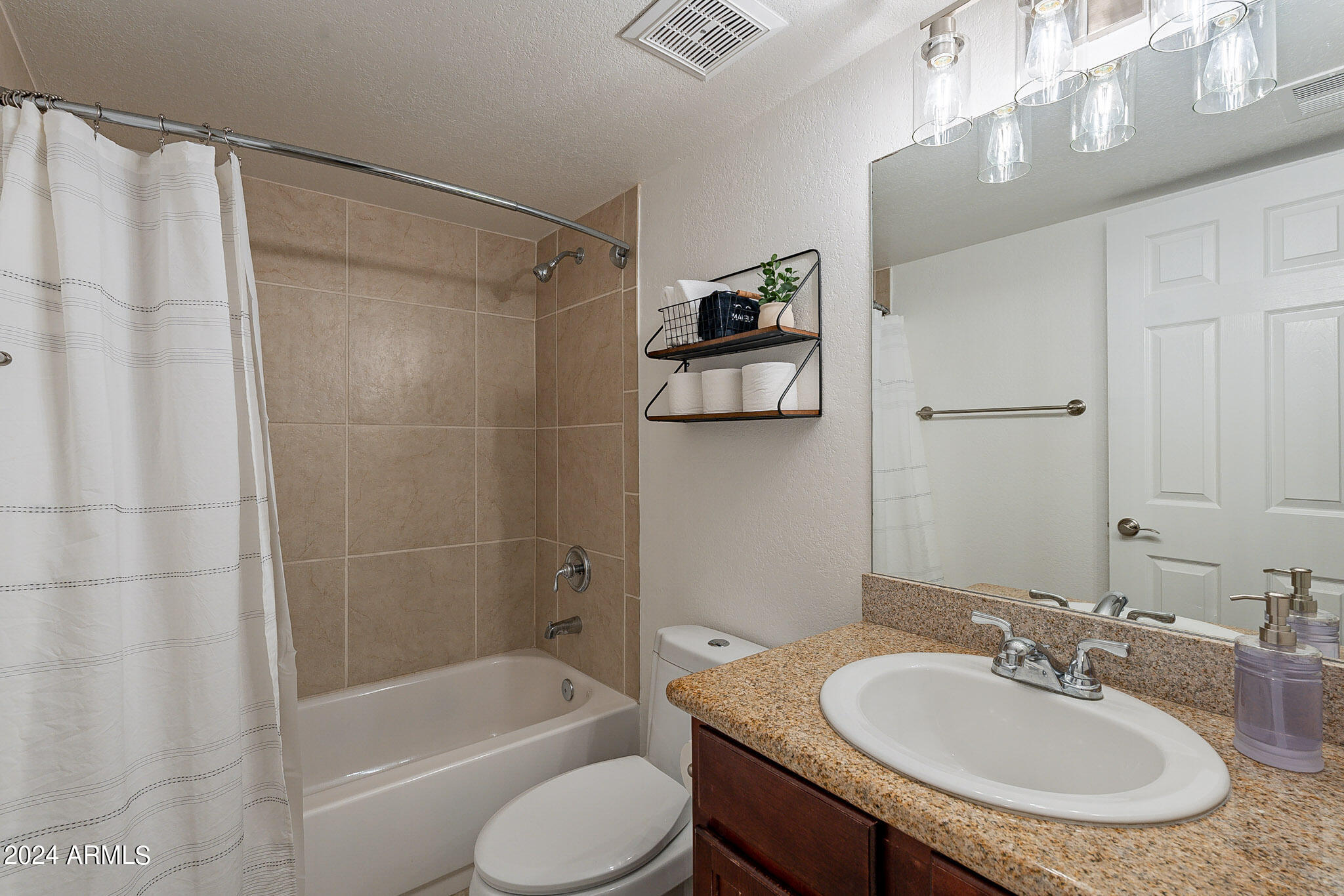 3500 North Hayden Road, Unit 1005 Scottsdale, AZ 85251 - Photo 21 of 51 a bathroom with a sink toilet and shower