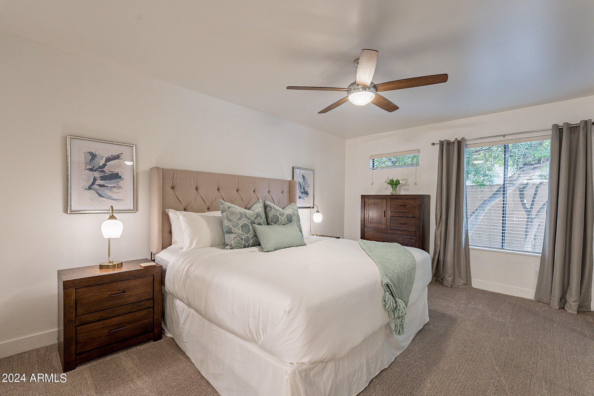 3500 North Hayden Road, Unit 1005 Scottsdale, AZ 85251 - Photo 22 of 51 a bedroom with a balcony a bed and a chandelier