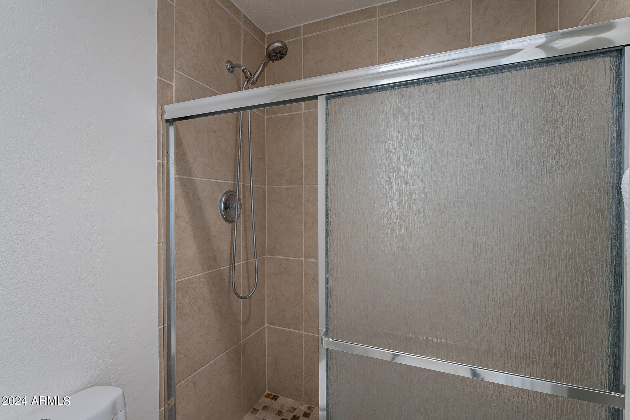 3500 North Hayden Road, Unit 1005 Scottsdale, AZ 85251 - Photo 26 of 51 a bathroom with a glass shower door