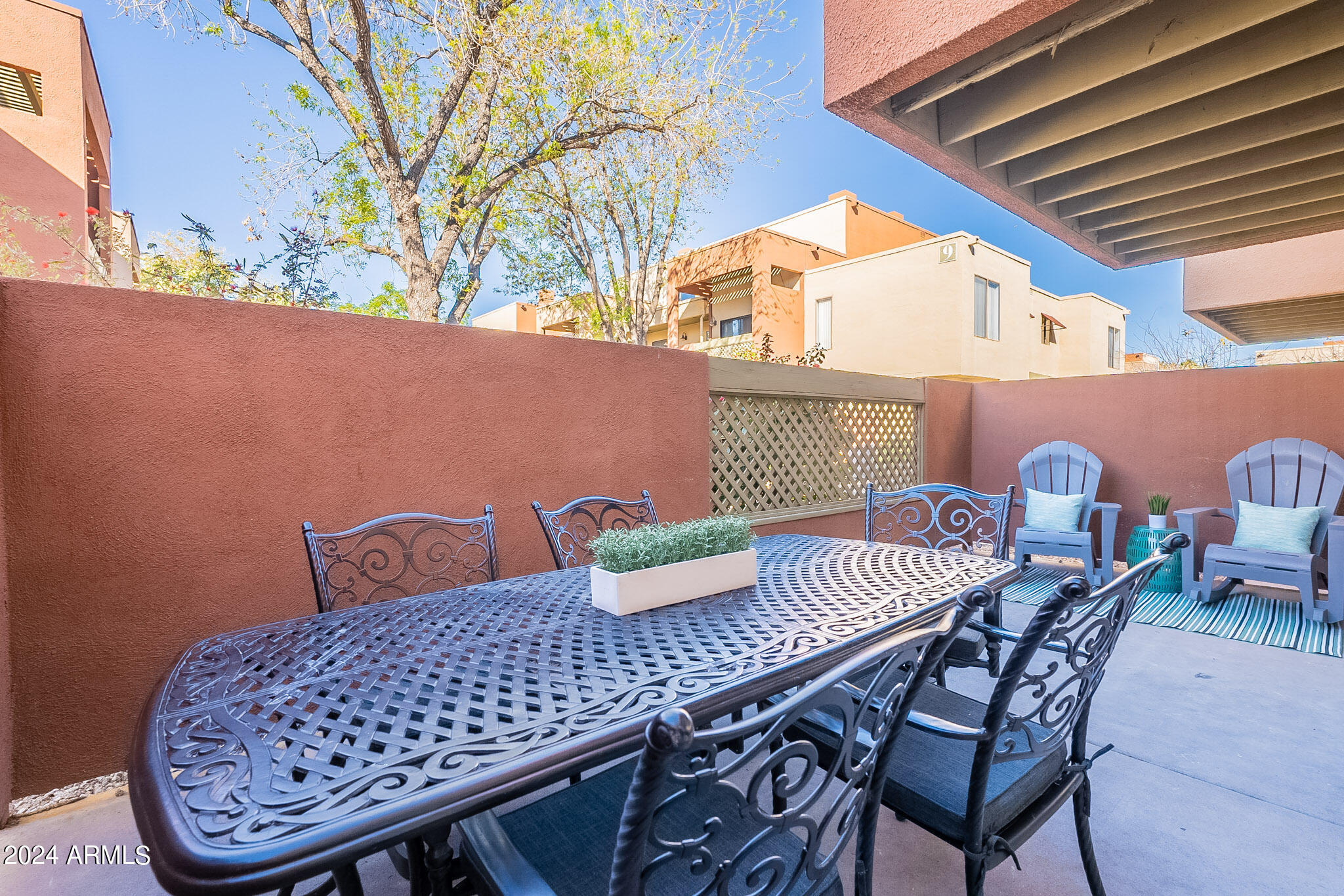 3500 North Hayden Road, Unit 1005 Scottsdale, AZ 85251 - Photo 32 of 51 a view of table and chair with potted plants