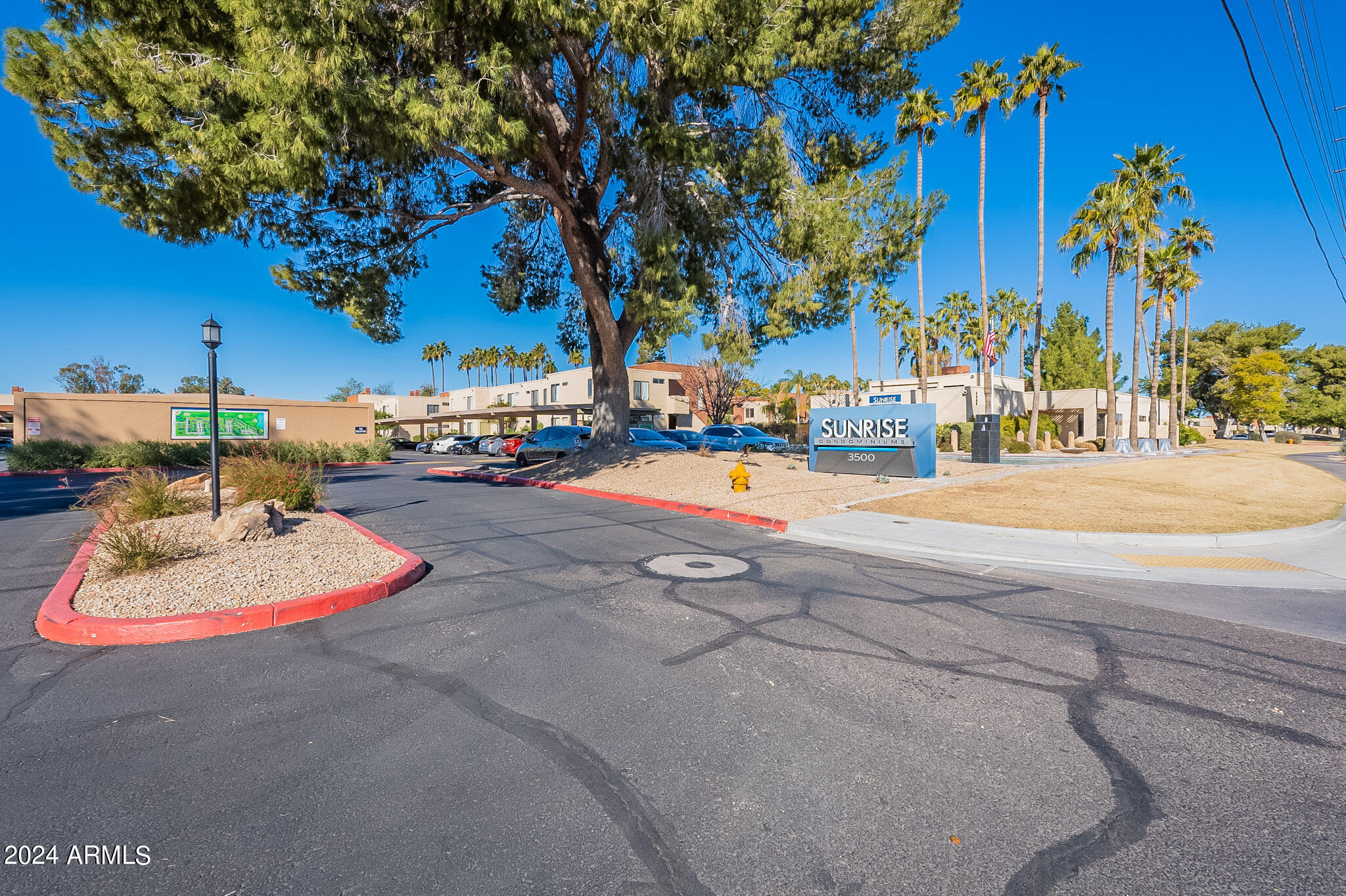 3500 North Hayden Road, Unit 1005 Scottsdale, AZ 85251 - Photo 33 of 51 a view of a playground with a house and trees