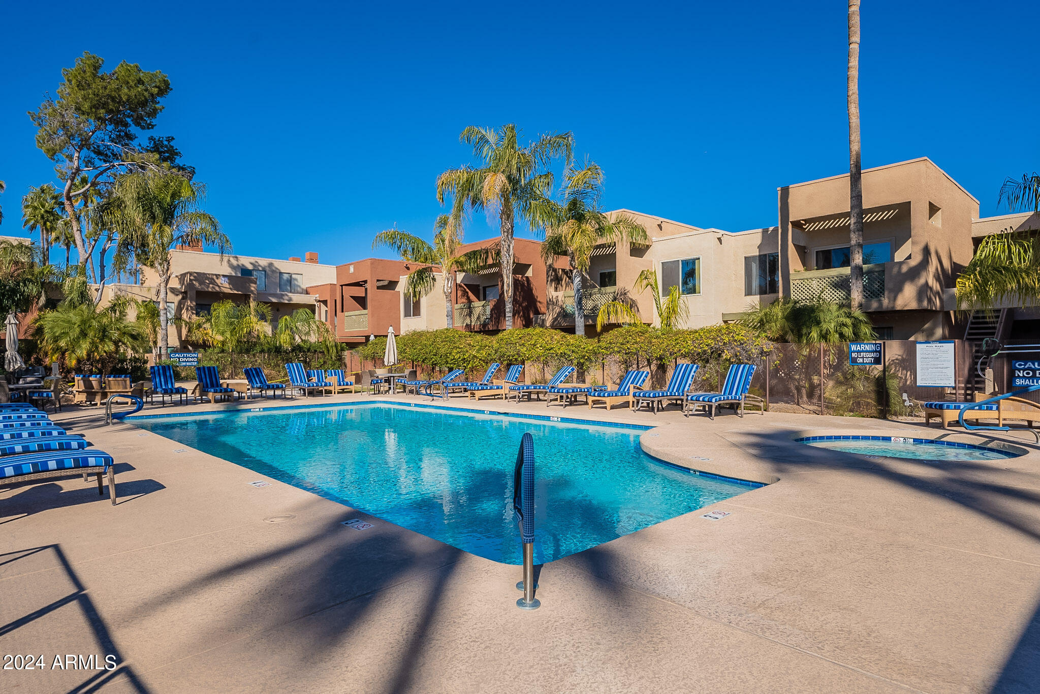 3500 North Hayden Road, Unit 1005 Scottsdale, AZ 85251 - Photo 35 of 51 a view of a swimming pool with outdoor seating