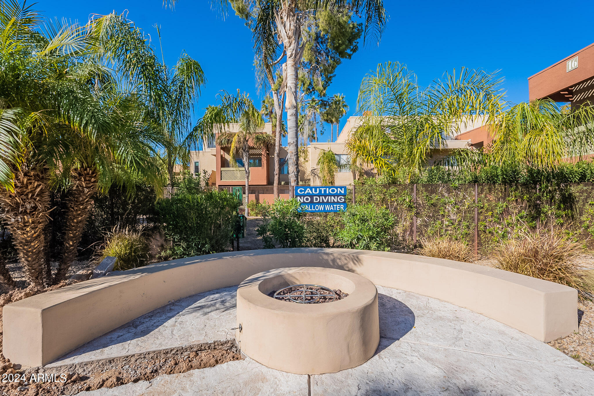 3500 North Hayden Road, Unit 1005 Scottsdale, AZ 85251 - Photo 39 of 51 a view of a swimming pool with an outdoor seating and a forest