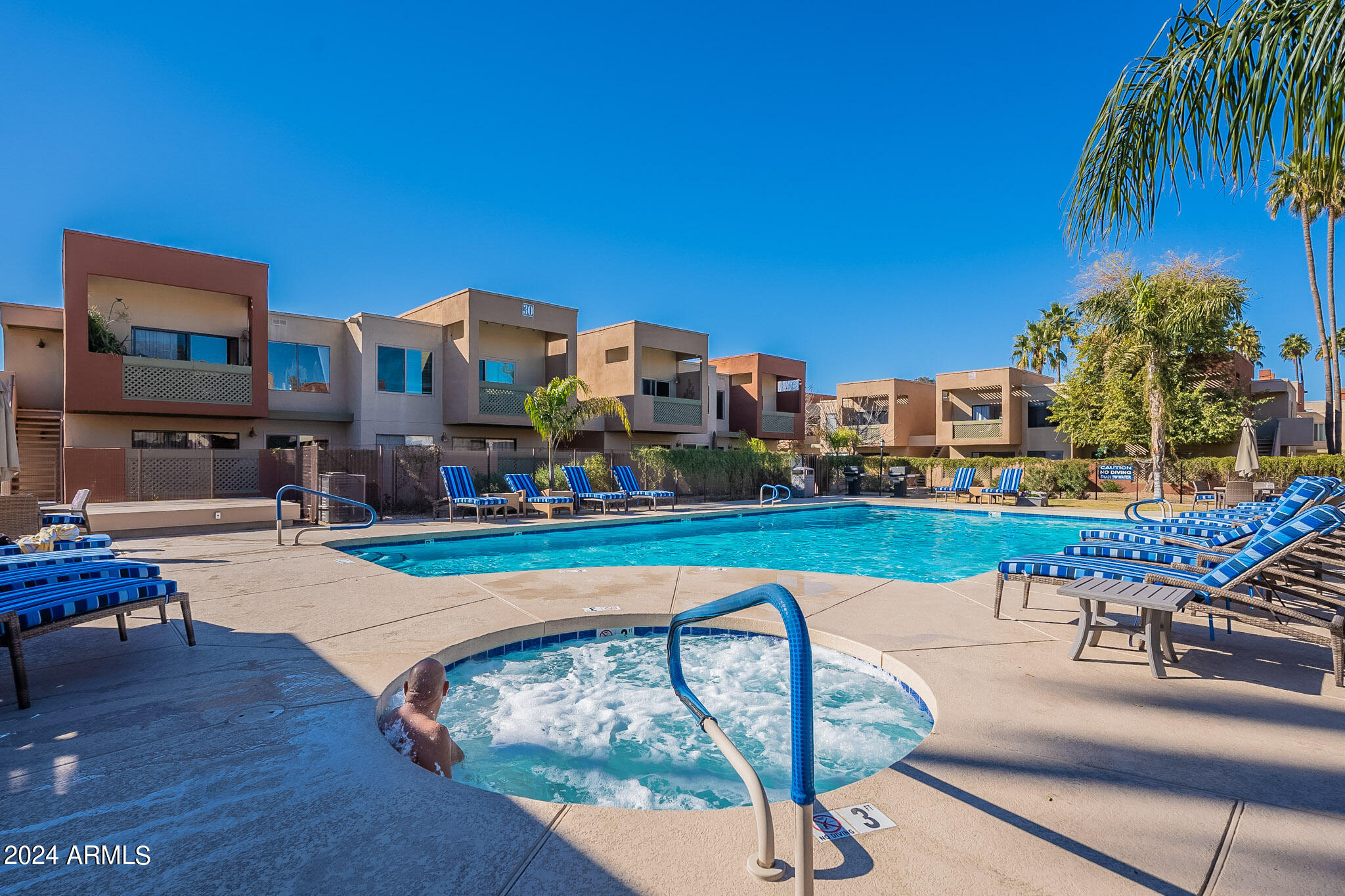 3500 North Hayden Road, Unit 1005 Scottsdale, AZ 85251 - Photo 50 of 51 a swimming pool with outdoor seating and yard