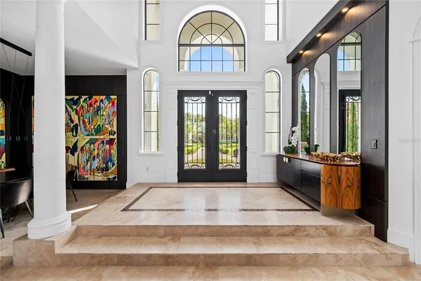a large kitchen with stainless steel appliances a refrigerator and a stove top oven