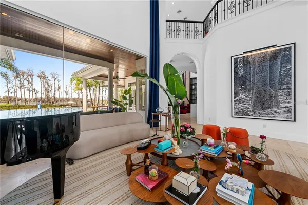 a very nice looking room with a large window and dining table