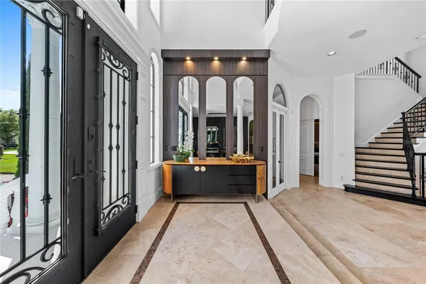 a room that has a bed and a table in it