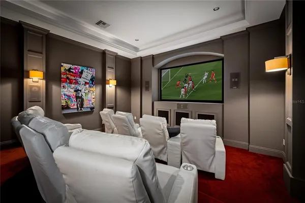 a view of a patio with a table chairs and a backyard