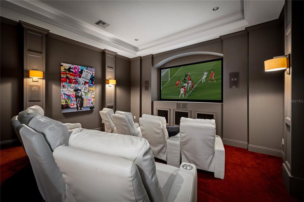 9343 Tibet Pointe Circle Windermere, FL 34786 - Photo 48 of 100 a living room with furniture and a flat screen tv