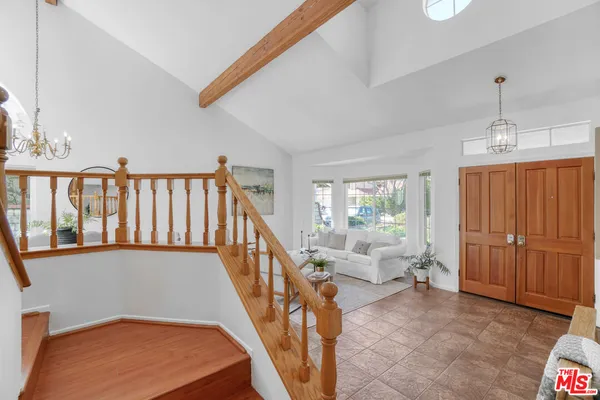 a view of an entryway with wooden floor