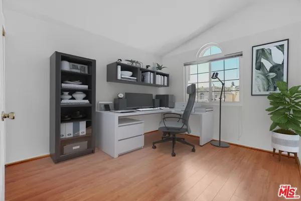 a workspace with furniture and window