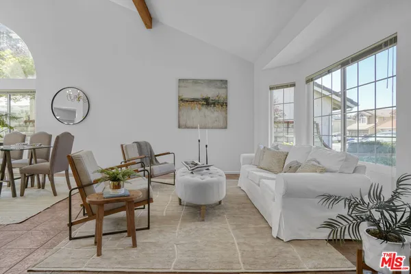 a living room with furniture and windows