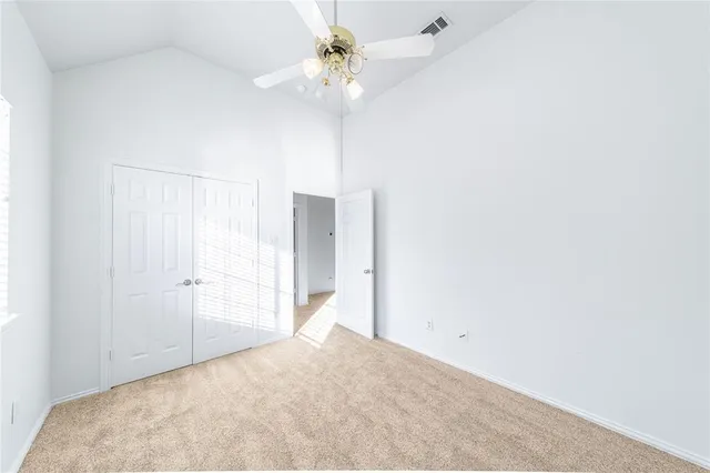 a view of a livingroom with a chandelier fan