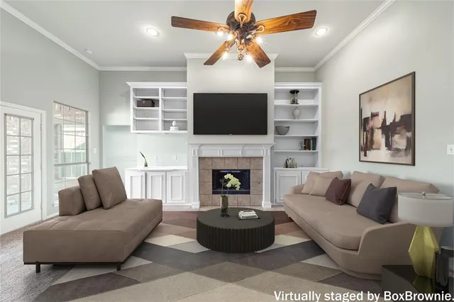 a living room with furniture a flat screen tv and a fireplace