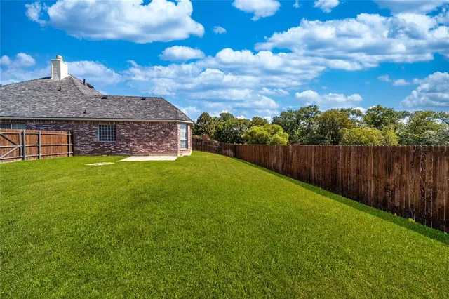 a view of a backyard with a garden