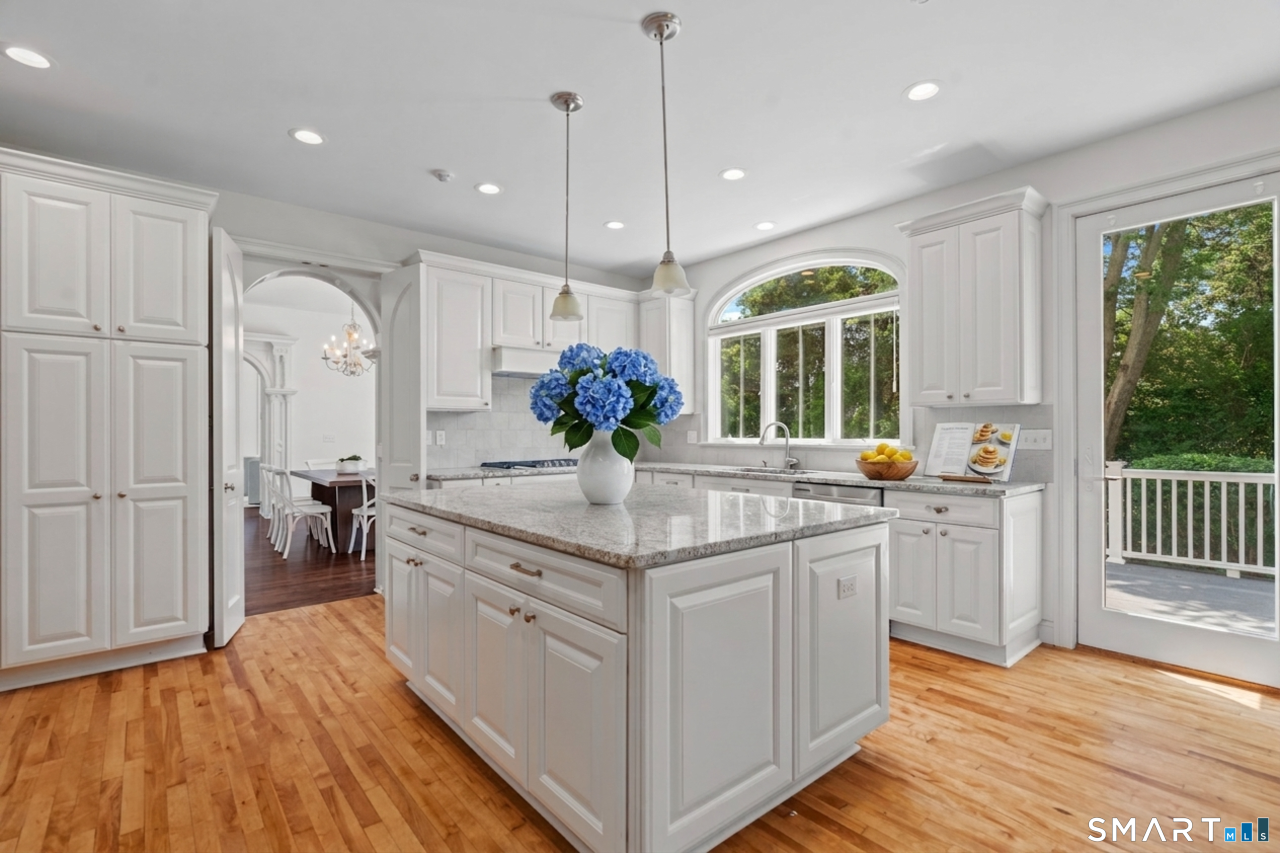 64 Webster Point Road Madison, CT 06443 - Photo 14 of 36 a view of a kitchen center island cabinets and wooden floor