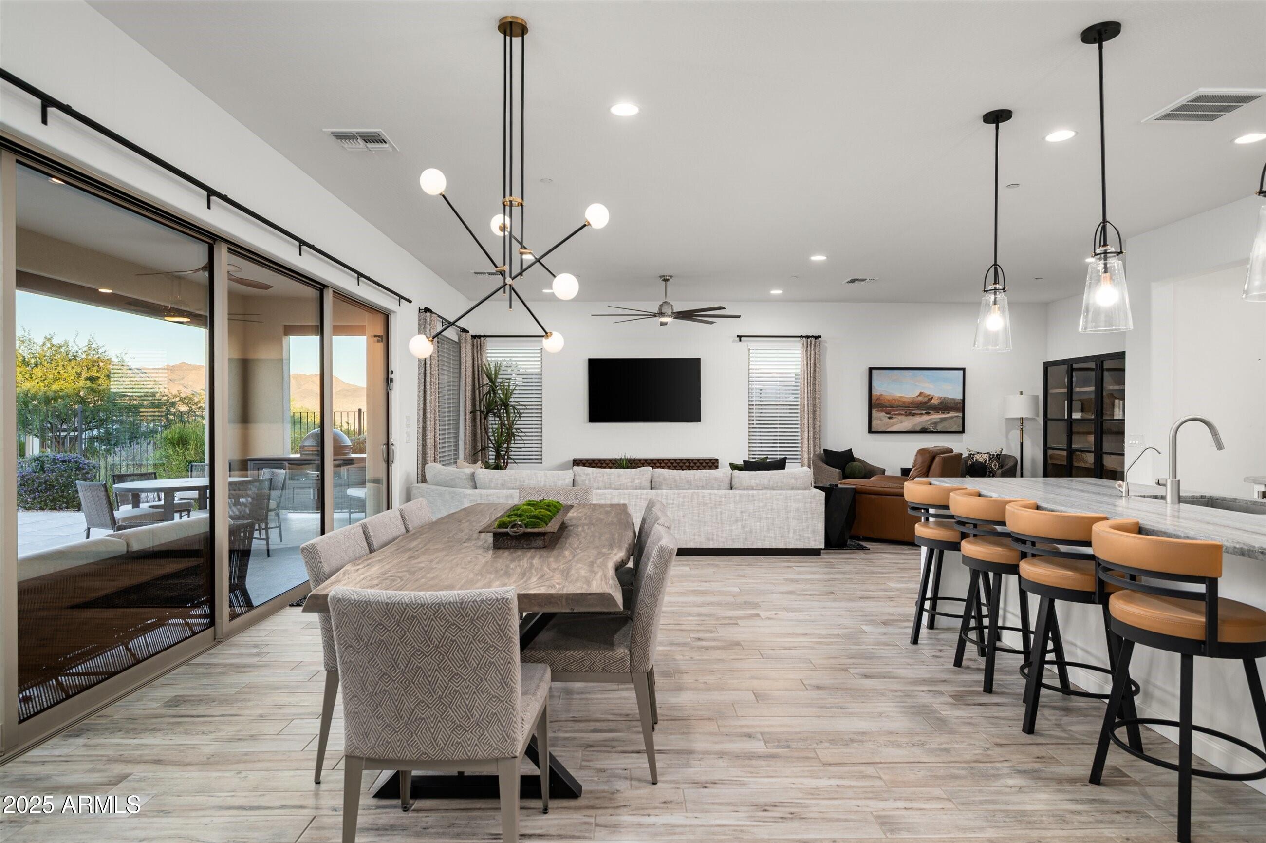 17864 East Veit Springs Drive Rio Verde, AZ 85263 - Photo 11 of 44 a view of a dining room with furniture window and wooden floor