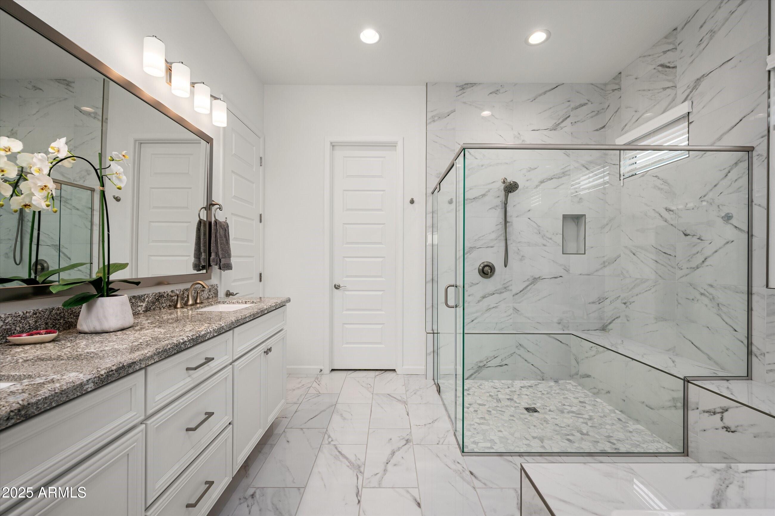 17864 East Veit Springs Drive Rio Verde, AZ 85263 - Photo 16 of 44 a bathroom with a granite countertop sink a mirror and shower