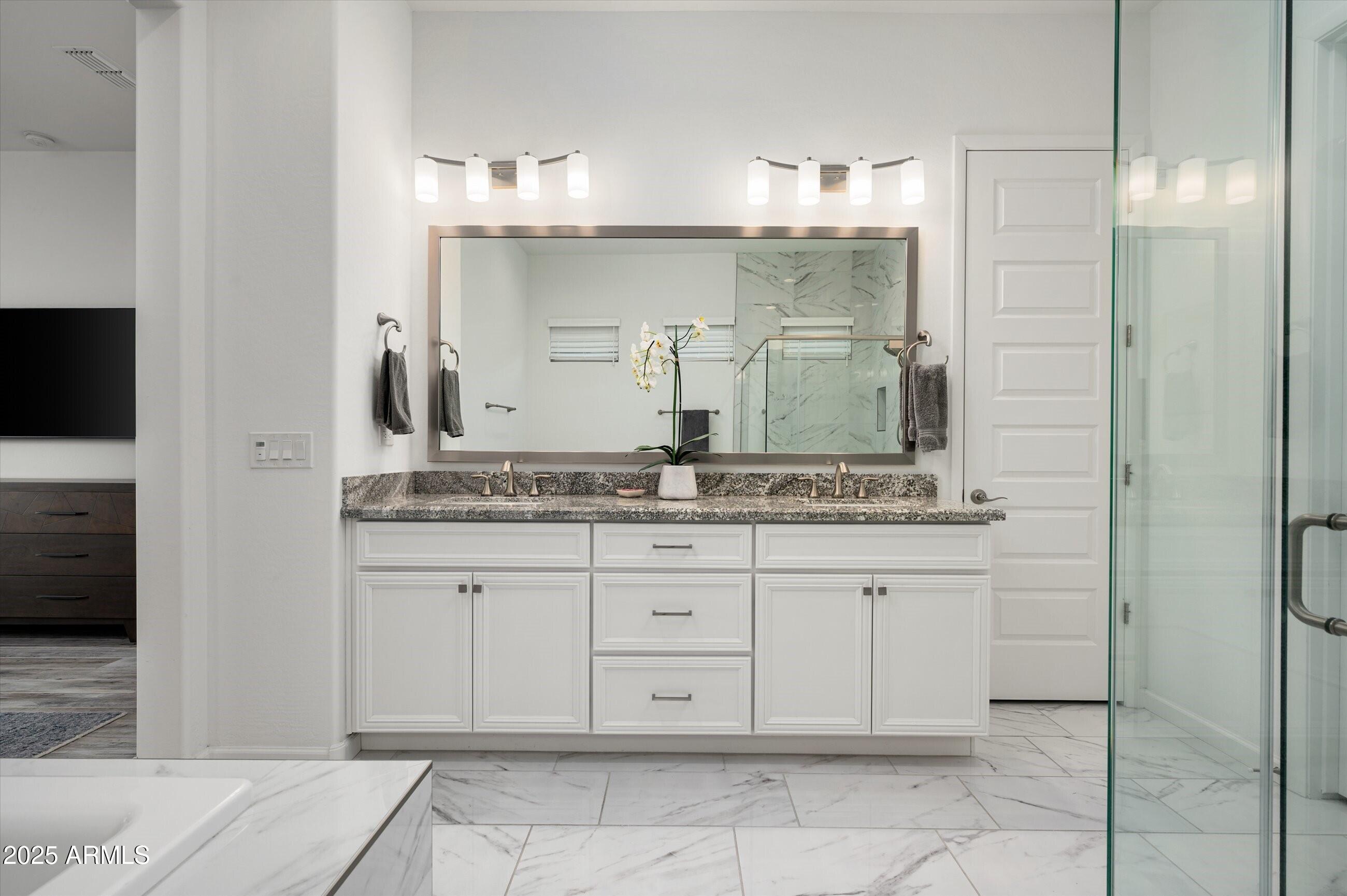 17864 East Veit Springs Drive Rio Verde, AZ 85263 - Photo 17 of 44 a bathroom with a granite countertop sink and a mirror