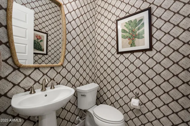 a bathroom with a toilet and a sink
