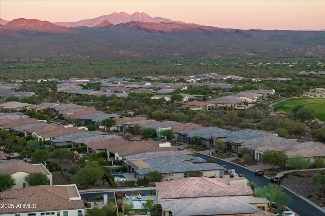 an aerial view of residential houses and outdoor space