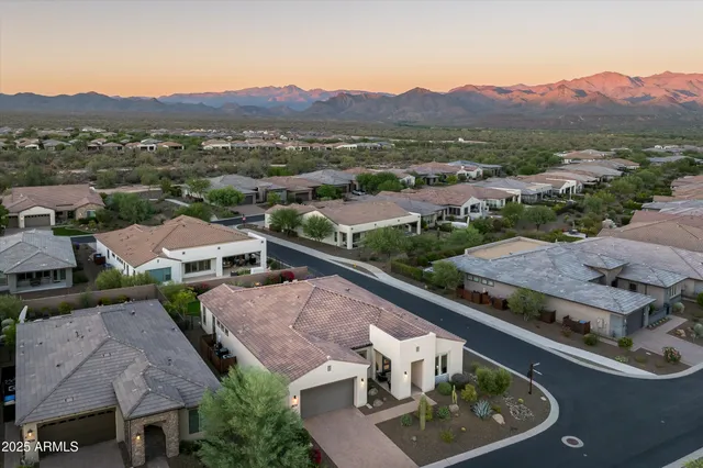 an aerial view of residential house and outdoor space
