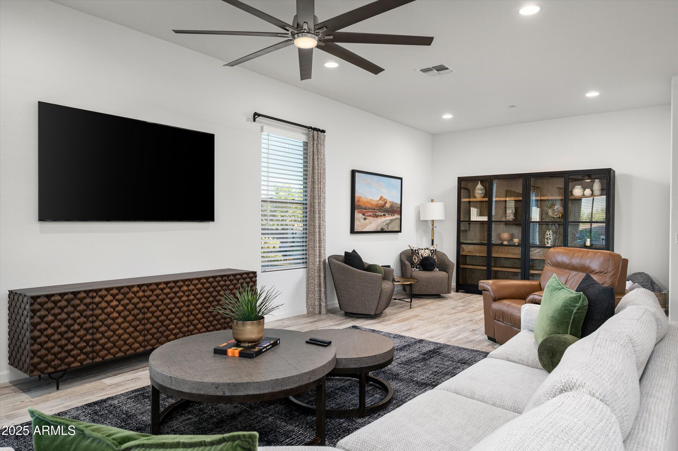 17864 East Veit Springs Drive Rio Verde, AZ 85263 - Photo 7 of 44 a living room with furniture and a flat screen tv