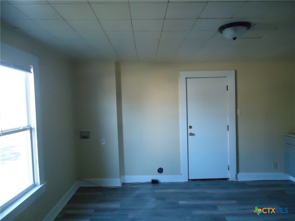 1101 South 33rd Street Temple, TX 76504 - Photo 3 of 8 a view of an empty room with wooden floor and a window