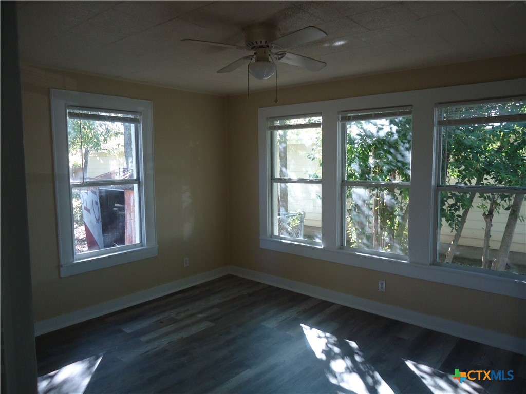1101 South 33rd Street Temple, TX 76504 - Photo 6 of 8 a view of an empty room with wooden floor and a window