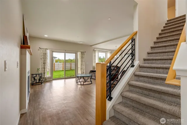a view of an entryway with wooden floor