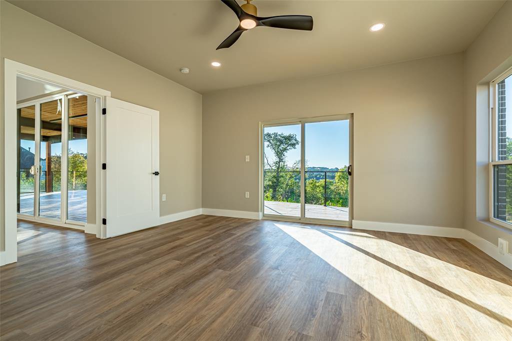 2128 Eagles Rdg Drive Weatherford, TX 76087 - Photo 36 of 39 Spare room with plenty of natural light, recessed lighting, wood finished floors, and a ceiling fan