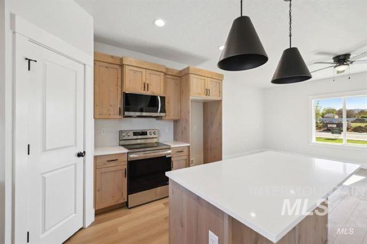937 Sierra Street Vale, OR 97918 - Photo 4 of 22 Quartz counter tops, custom cabinets - Photo is similar.