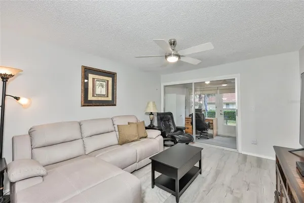 a living room with furniture and a table
