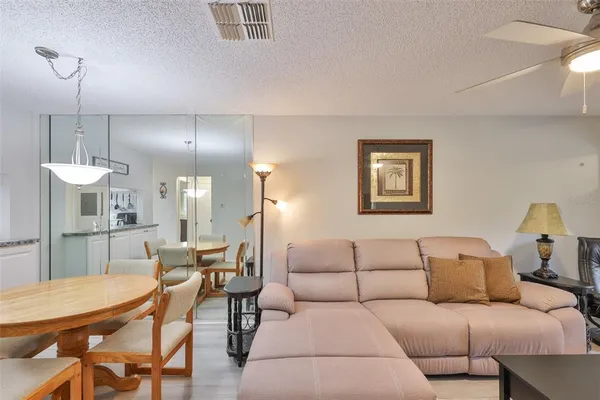 a room with a bed and a chandelier