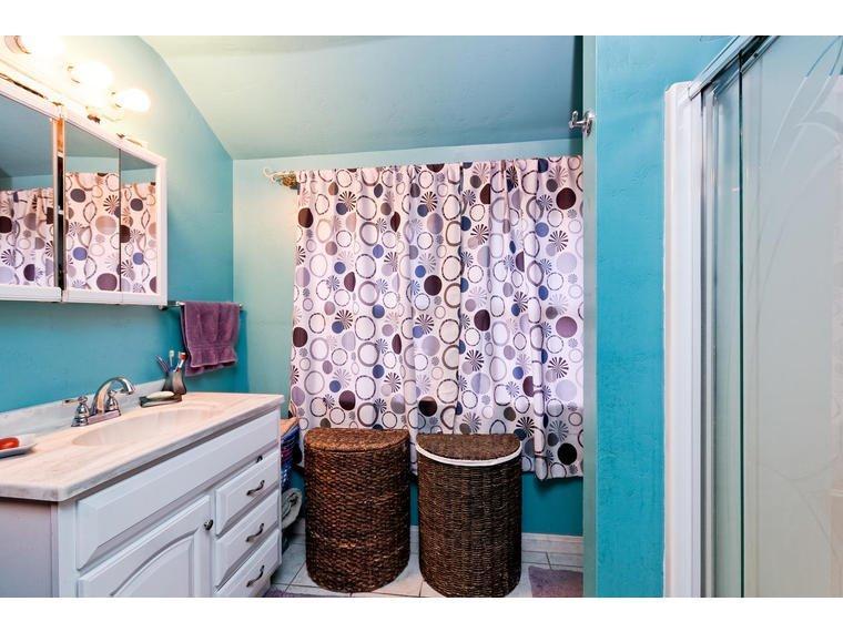 142 Valley Road Oak View, CA 93022 - Photo 6 of 10 a bathroom with a sink and a mirror