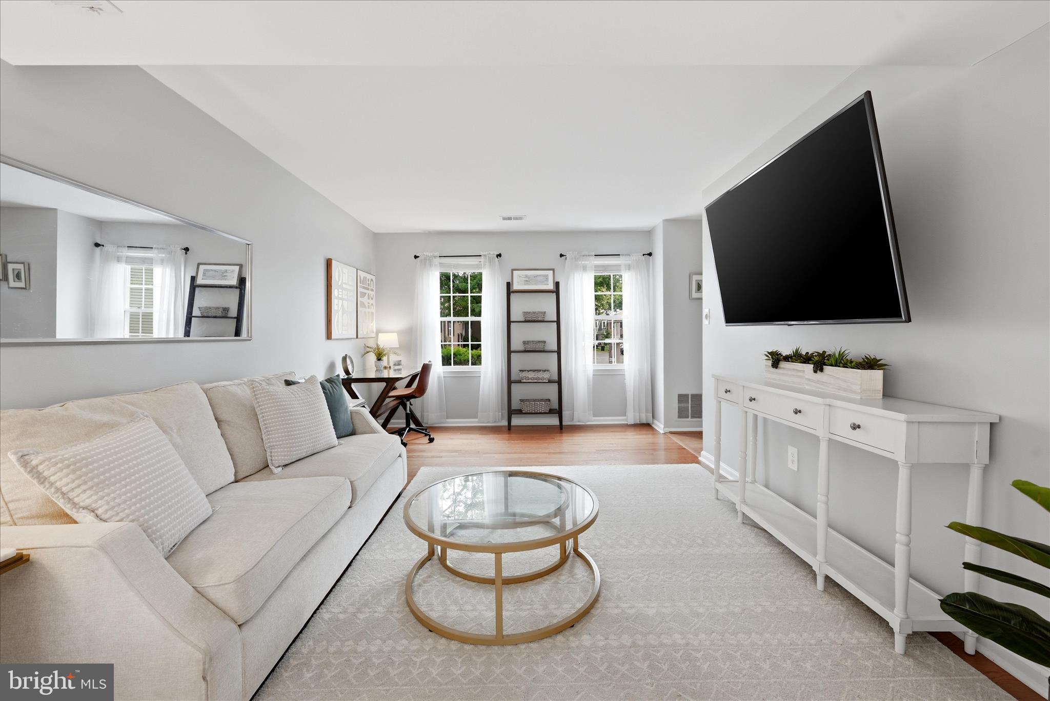 5446 Lighthouse Lane Burke, VA 22015 - Photo 3 of 36 a living room with furniture and a flat screen tv