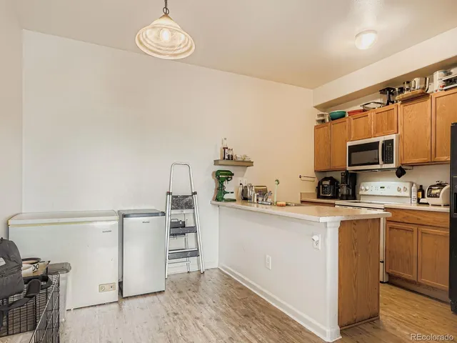 a kitchen with stainless steel appliances granite countertop a sink and cabinets