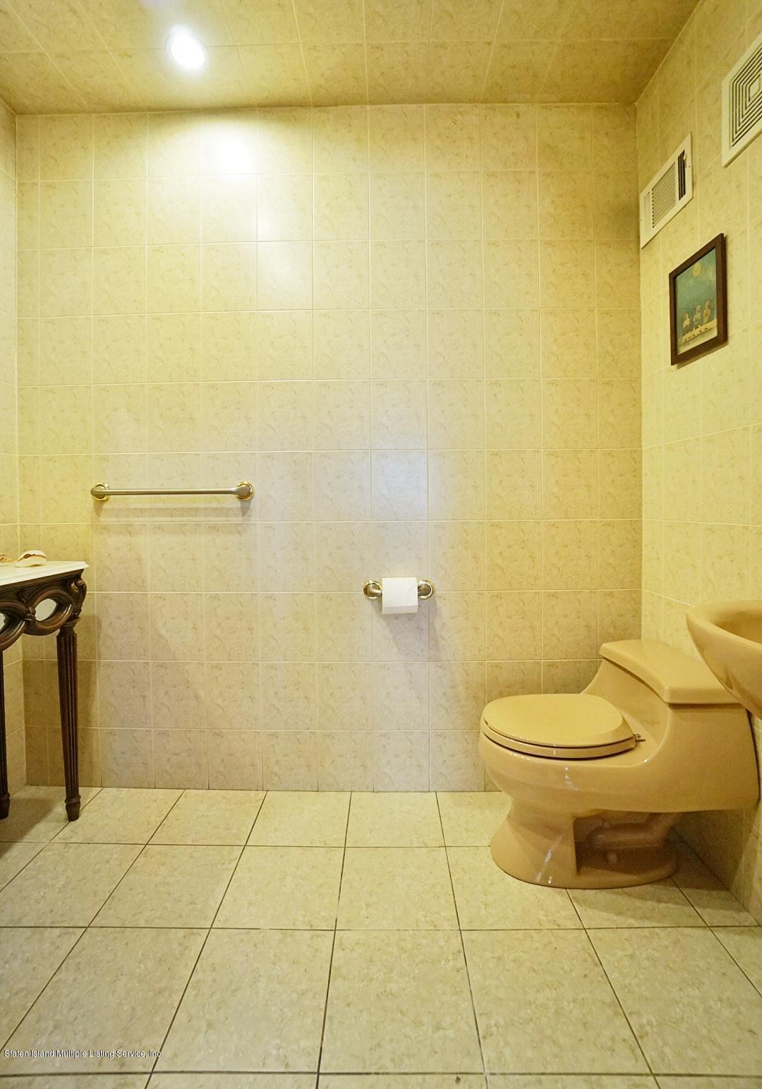 2223 Clove Road Staten Island, NY 10305 - Photo 19 of 46 (19) Half Bath Main Level off Family Roo