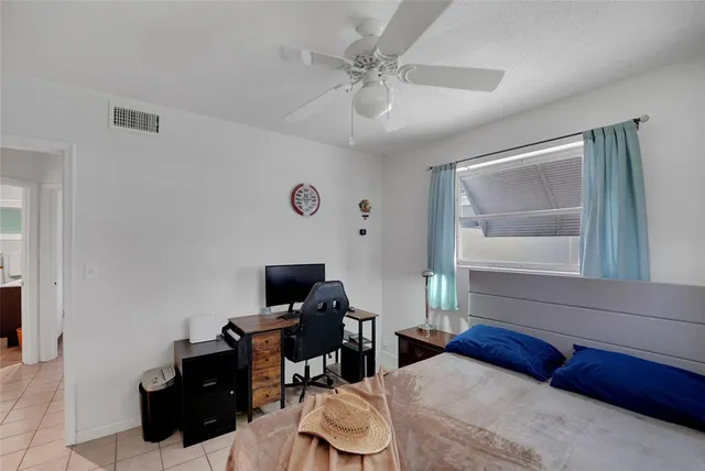 a bedroom with furniture and a window