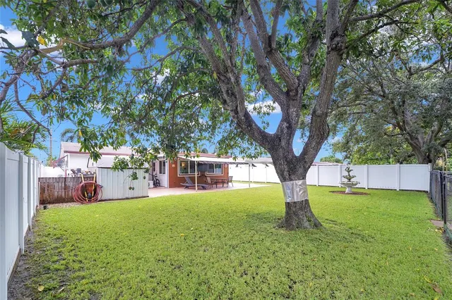a backyard of a house with lots of green space