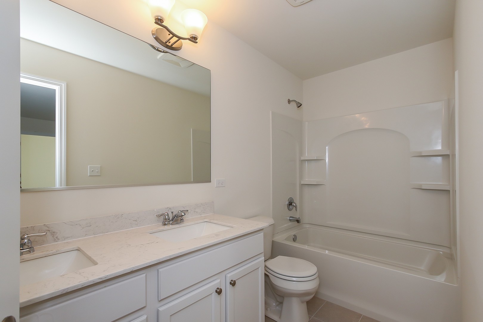 1309 Endicott Road South Elgin, IL 60177 - Photo 27 of 29 a bathroom with a sink a toilet and shower