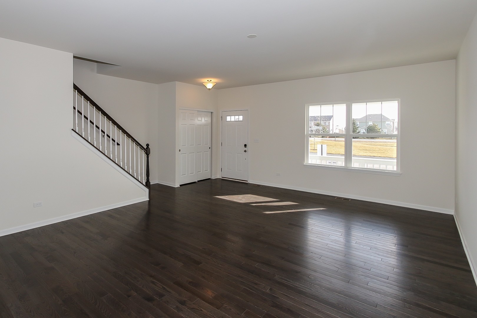 1309 Endicott Road South Elgin, IL 60177 - Photo 4 of 29 a view of empty room with wooden floor and fan
