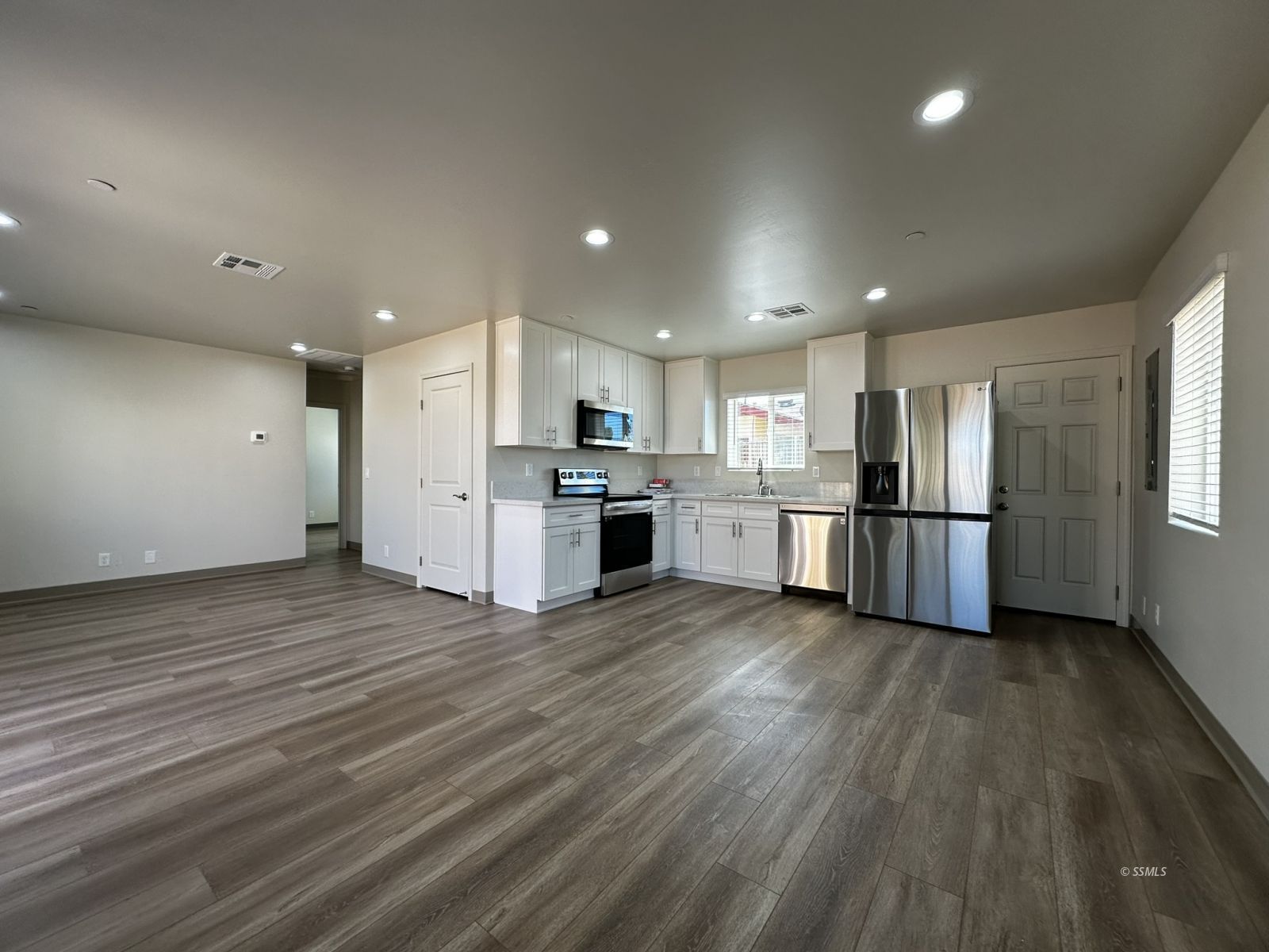 1424 South Farragut Street Ridgecrest, CA 93555 - Photo 4 of 13 a view of kitchen with wooden floor and electronic appliances