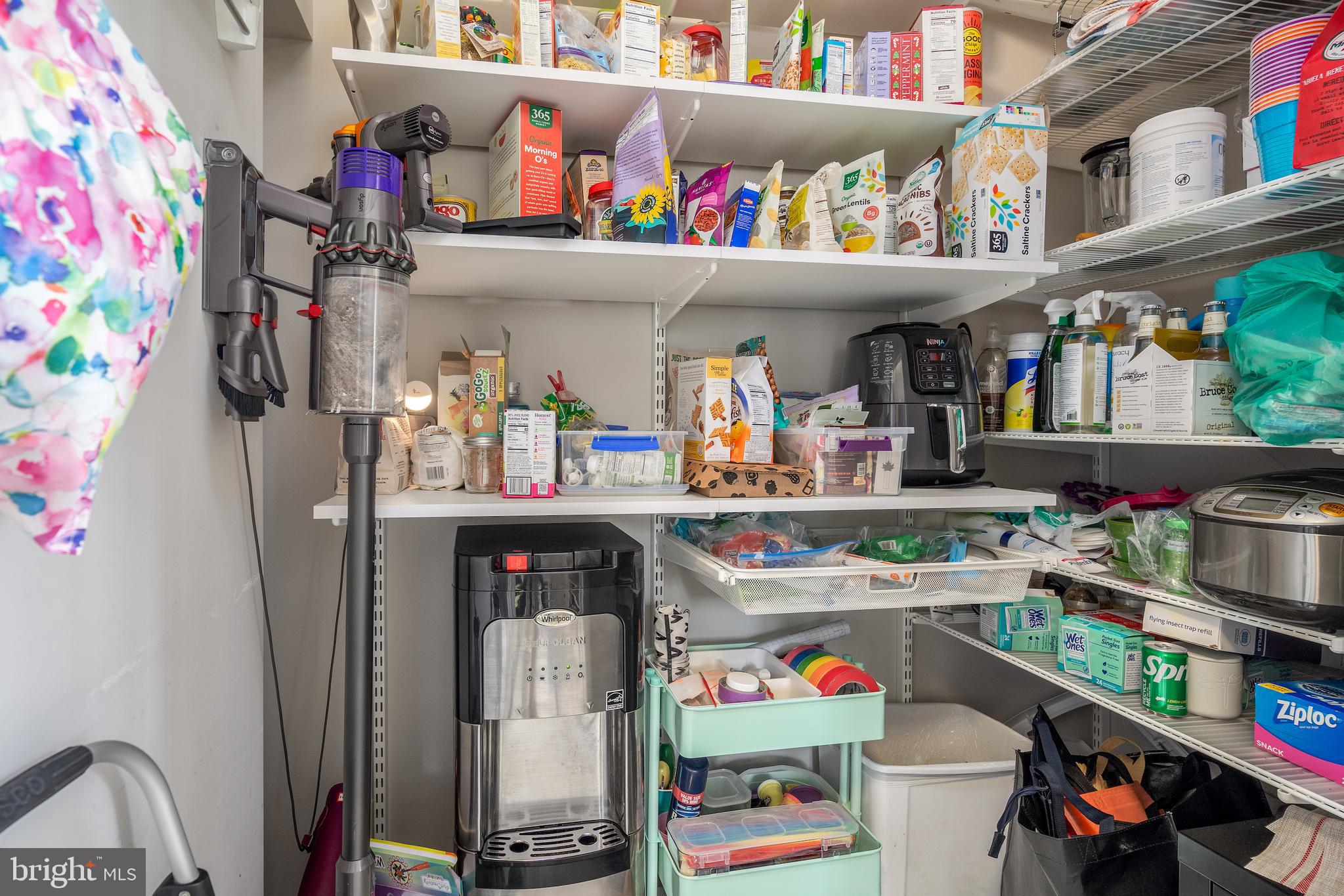 676 Glenmary Road Wayne, PA 19087 - Photo 14 of 38 a store room with lots of clutter and refrigerator